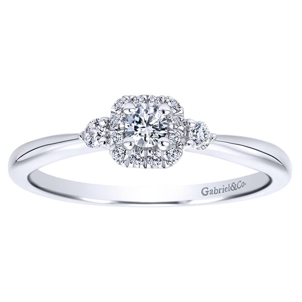 This 14k white gold petite diamond halo engagement ring is studded with 0.19 carats in round brilliant diamonds is a simple and sleek diamond engagement ring that makes a clear message. This 14k white gold petite diamond halo engagement ring is studded with 0.19 carats in round brilliant diamonds is a simple and sleek diamond engagement ring that makes a clear message.