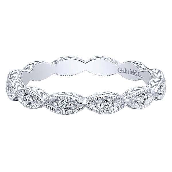 Delicate oval sections of 14k white gold hold shimmering round diamonds, all lining up to create this diamond stackable ring.