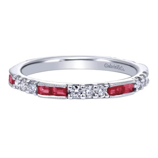 This 14k white gold diamond and ruby stackable ring has 0.39 carats of round brilliant diamonds and 1/3 carats in baguette shape rubies. This 14k white gold diamond and ruby stackable ring has 0.39 carats of round brilliant diamonds and 1/3 carats in baguette shape rubies.