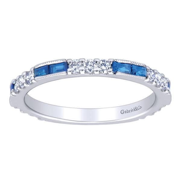 Sapphires line up with diamonds over 14k white gold in this sapphire and diamond stackable ring featuring one third carats in sapphire and almost one half carats in round diamonds.