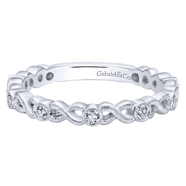 This 14k white gold diamond infinity stackable ring boasts round brilliant diamonds.