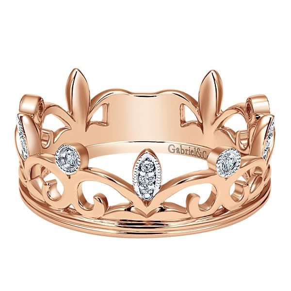 This 14k rose gold diamond stackable ring is fashioned like a crown.