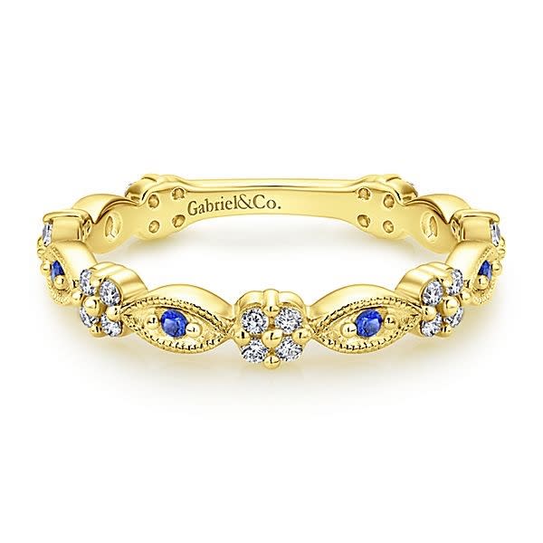 This 14k yellow gold sapphire and diamond ring is a stackable style.