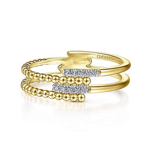 This 14k yellow gold diamond stackable ring features beaded gold with rows of diamonds.