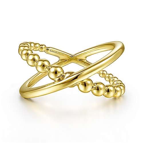 This simple and elegant 14k yellow gold beaded x ring makes a statement.