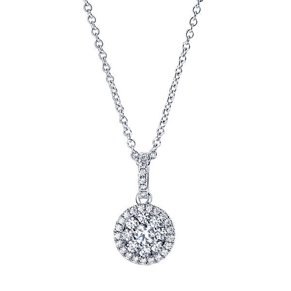 This 14k white gold diamond cluster necklace features a round diamond halo hanging from a diamond bale in this 14k white gold diamond necklace. This 14k white gold diamond cluster necklace features a round diamond halo hanging from a diamond bale in this 14k white gold diamond necklace.