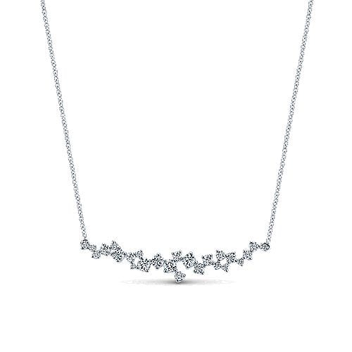 This dreamy diamond bar necklace in 18k white gold features different sized round brilliant diamonds set into a bar.
