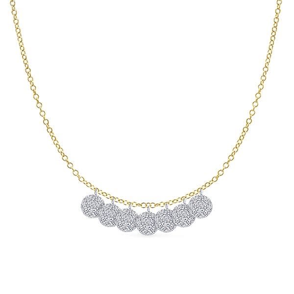 This beautiful 14k white gold diamond necklace features delicate diamond discs.