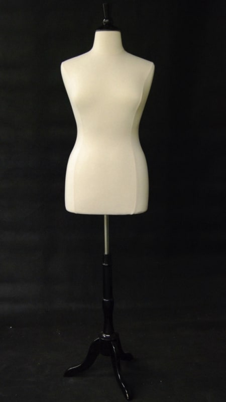 Size 10/12 female foam dress form with jersey cover and black wooden tripod base for retail garment display. Size 10/12 female foam dress form with jersey cover and black wooden tripod base for retail garment display.