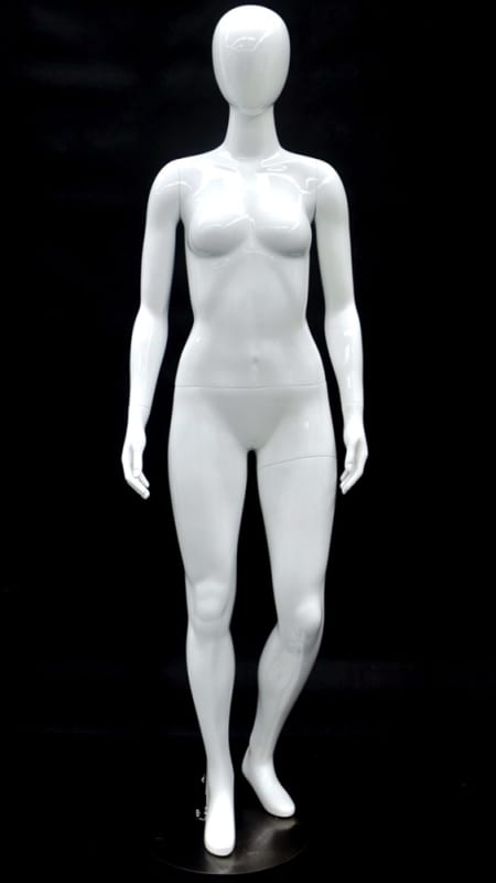 Glossy white petite female fiberglass mannequin in a walking pose with a bent left leg and round metal base. Glossy white petite female fiberglass mannequin in a walking pose with a bent left leg and round metal base.