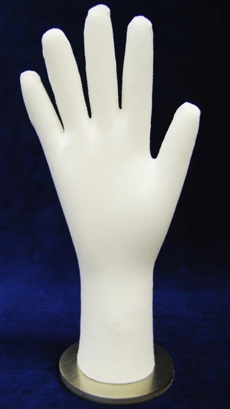 Flexible posable white fabric hand display with round metal base