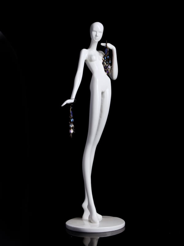 Glossy white fiberglass mini jewelry mannequin in a dancer-inspired pose with an integrated pedestal base for displaying bracelets and necklaces.