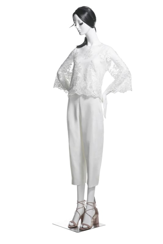 Female abstract mannequin in standing pose with bent arm, matte white fiberglass finish Â– ideal for fashion retail and boutique display