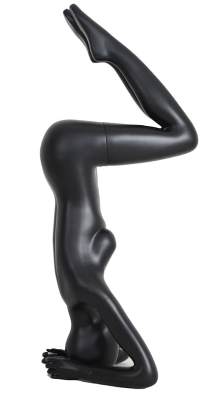Female yoga mannequin in a headstand pose made of matte black fiberglass with an abstract egghead.