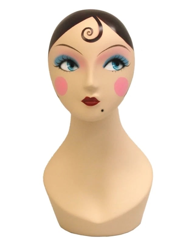 Vintage 1920s female display head with black hair and makeup Vintage 1920s female display head with black hair and makeup