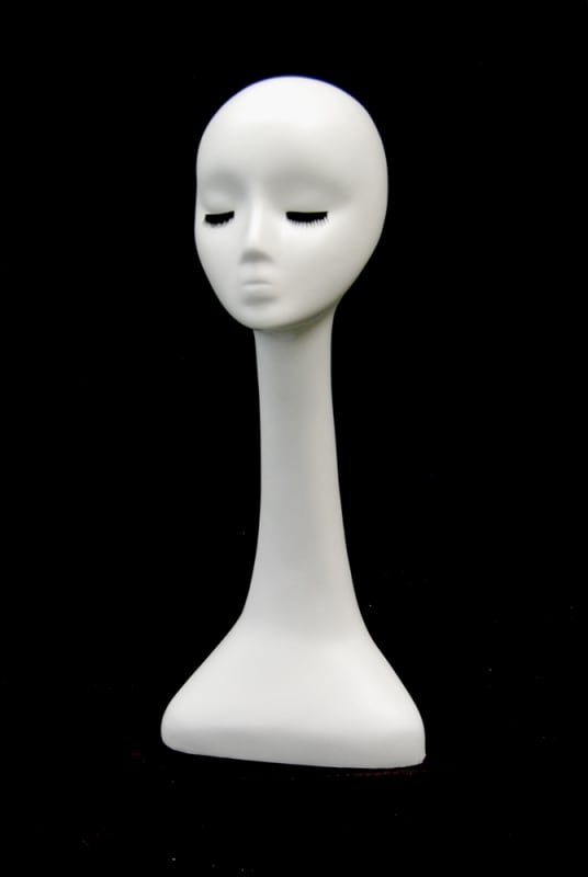 Gloss white abstract fiberglass display head with swooping design and integrated base for retail accessory merchandising.