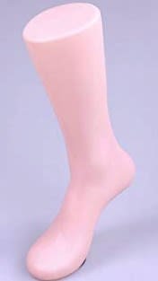 Tan plastic male foot form with magnetic weighted toe for secure shoe and sock display on metal shelving Tan plastic male foot form with magnetic weighted toe for secure shoe and sock display on metal shelving
