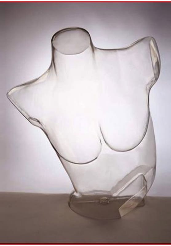 Clear female torso form with a raised left shoulder made of unbreakable plastic for retail clothing display. Clear female torso form with a raised left shoulder made of unbreakable plastic for retail clothing display.