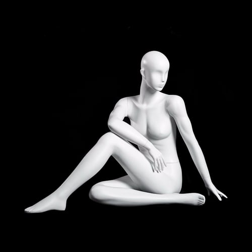 Glossy pearl female yoga mannequin in seated twist pose for fitness and activewear retail display