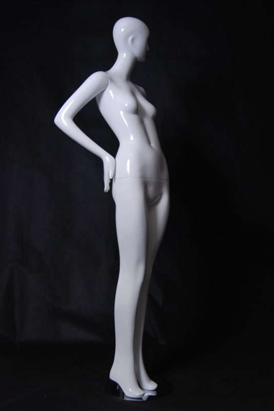 Tall standing female abstract mannequin in a glossy white fiberglass finish with a silver metal base.