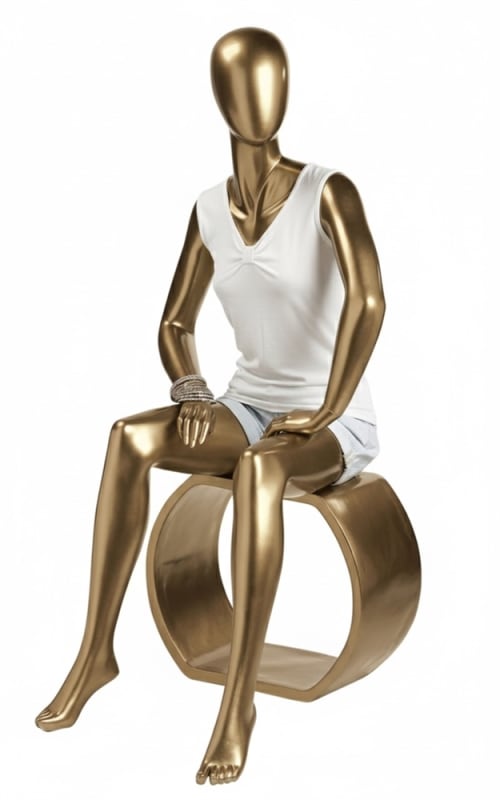 gold female fiberglass egghead mannequin sitting angled left modern retail display