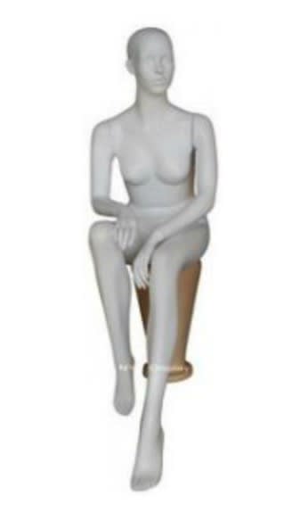 Matte white seated female mannequin with realistic head, egghead design, fiberglass construction, and hands resting in lap for apparel displays