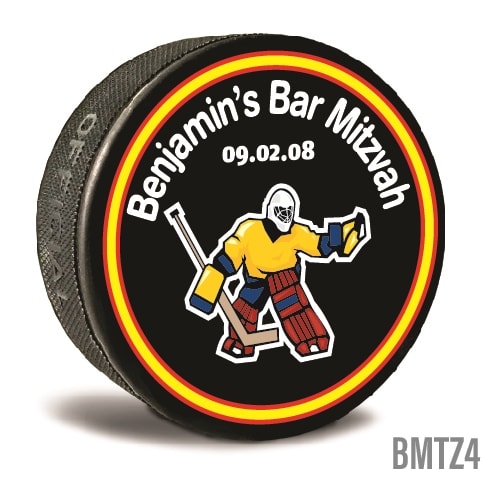 A custom printed hockey puck is personalized in bright colors and text written to personalize it for the recipients. Celebrate your Bar Mitzvah and  let guests take home a memory.