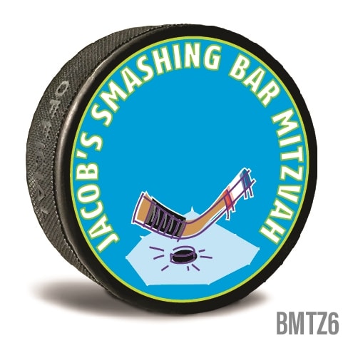 A custom printed hockey puck is personalized in bright colors and text written to personalize it for the recipients. Celebrate your Bar Mitzvah and  let guests take home a memory.