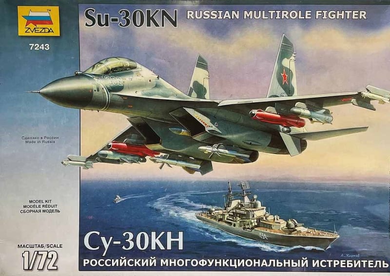 Box art illustration of Russian supersonic aircraft, Su-30KN, flying over a U.S. Navy Destroyer.