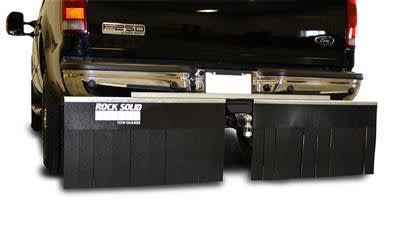 The Smart Solutions Rock Solid Towed Vehicle Shield (part number 01868) mounts to a 2" or 2.5" receiver hitch to protect towed vehicles from road debris. It is made of durable, all-weather resistant thermoplastic rubber and features a two-piece design.