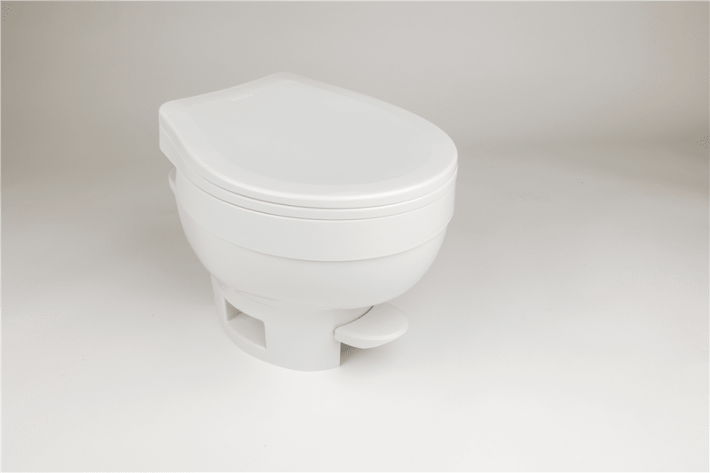 The Thetford Aqua-Magic VI Low Profile Toilet (31833) is a permanent, all-plastic RV toilet with a space-saving design, foot flush, and a residential-sized slow-close seat.
