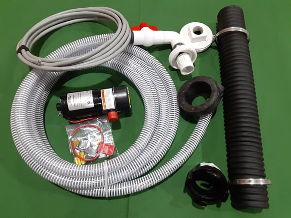 The Clean Dump CDPU (Clean Dump Permanent Unit) is a permanently installed RV macerator pump system designed to replace standard 3-inch gravity-fed sewer hoses with a faster, cleaner waste removal process.