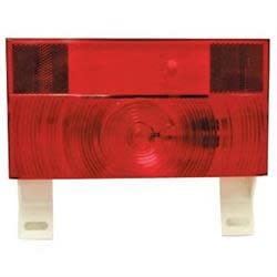 The Peterson Manufacturing V25913-25 is a red rectangular replacement lens for RV and trailer combination tail lights, specifically designed for the Peterson V25913 series. It includes a clear license plate illuminator lens.