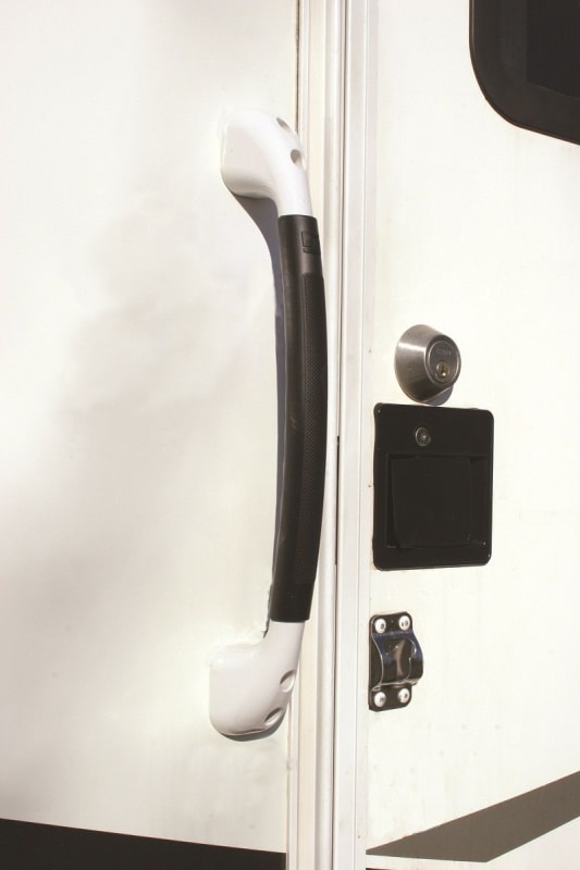 The Stromberg Carlson AH-100 EXTERIOR GRAB BAR HANDLE in white is a curved, plastic grab bar designed to provide a secure, soft-touch grip for entering and exiting an RV.