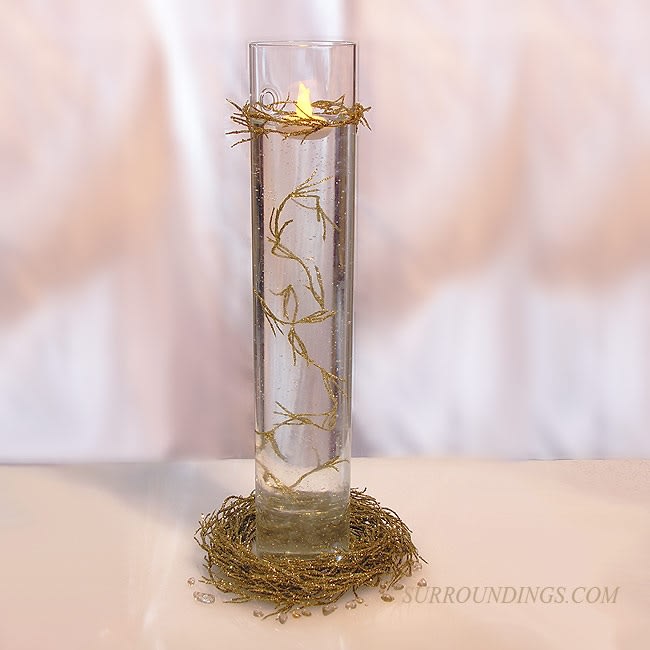 Cylinder in Gold Nest Centerpiece includes gold vine garland and battery floating candle