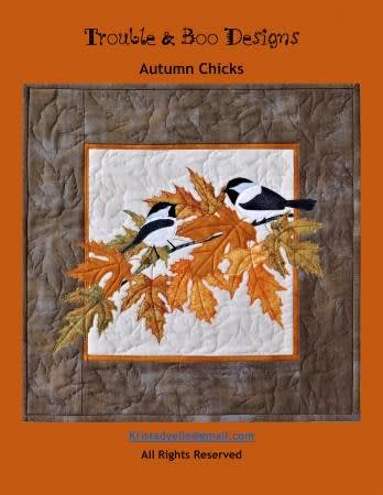 AUTUMN CHICKS Quilt Pattern by Trouble & Boo shows a pair of  black catp chickadees resting on fall foiliage.