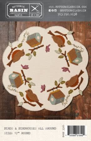 BIRDS & BIRDHOUSES WOOL MAT PATTERN from Buttermilk Basin shows a cream colored mat with small birds intermixed with bird houses.