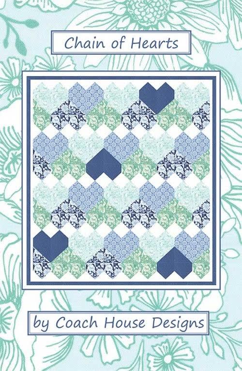 Chain of Hearts Quilt Pattern by Cocah House Designs shows a large, twin size quilt made of  heartsall in a row.