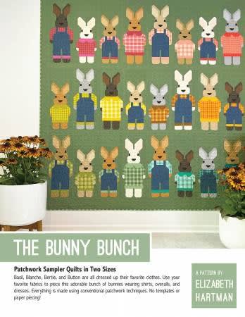 The Bunny Bunch Quilt Pattern by Elizabeth Hartman shows a bevy of bunnies of all different sizes, some tall, some small.