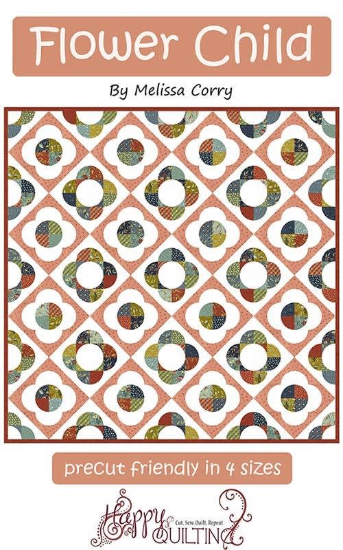 Flower Child Quilt Pattern by Melissa Corry shows a pretty scrappy quilt with circles and squares in a flower design.