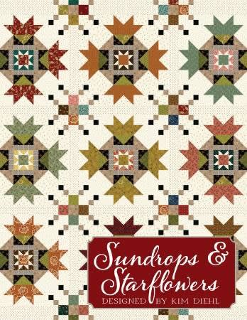 Sundrops & Starflowers Quilt Pattern  by Kim Diehl shows a starflower block quilt with a a center star block.
