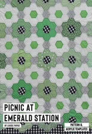 Picnic at Emerald Station Quilt Pattern shows a cream and green hexagon flower quilt .