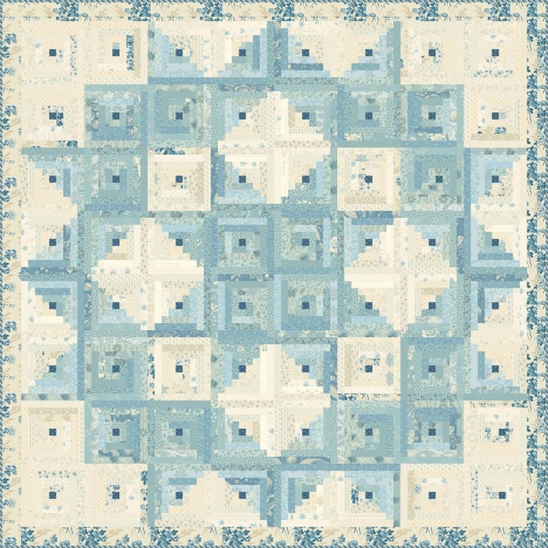 Pioneer Log Cabin Quilt Pattern  by Laundry Basket Quilts shows small log cabin blocks in shades of blue and cream with a narrow outer floral border.