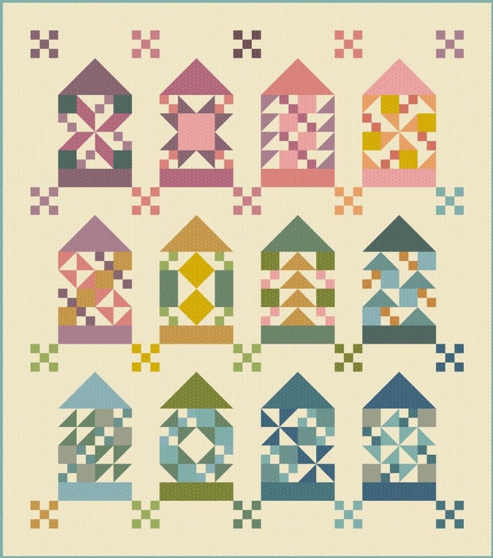 Quilter's House Quilt Pattern by Edyta Sitar, Laundry Basket Quilts shows a pieced quilt, in multi colors of teals, blues,  pinks, greens, and beige.