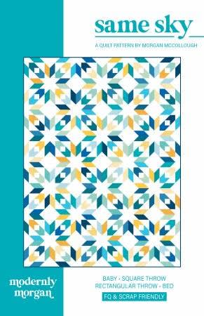 This allover quilt design features stars and diamond shapes in shades of blue, with yellow accents on a white ground.