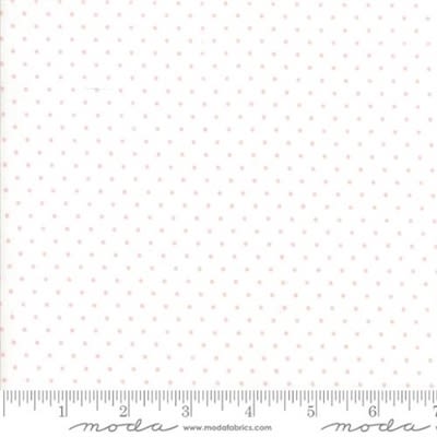 Essential Dot Baby Pink on White by Moda shows a fabric with a barely there pale pink dot on a white background. Essential Dot Baby Pink on White by Moda shows a fabric with a barely there pale pink dot on a white background.