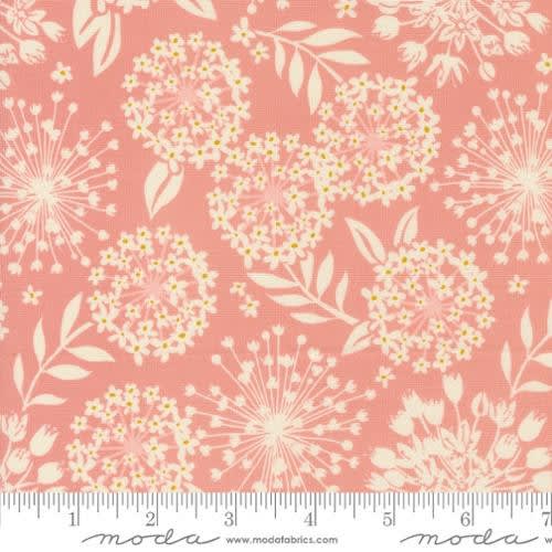 Tango Simpatico Petal Pink 27332 -13 shows a stylized floral pouf with burst of flowers and leaves in-between in soft pale pink.