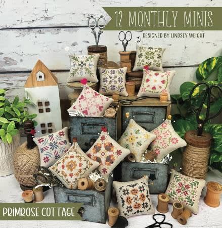 12 Monthly Minis Cross Stitch Pattern from Primrose Cottage shows 12 mini pillows.