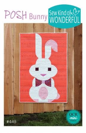Posh Bunny Quilt Pattern from Sew Kind of Wonderful features an Easter bunny with big floppy ears on a red background.