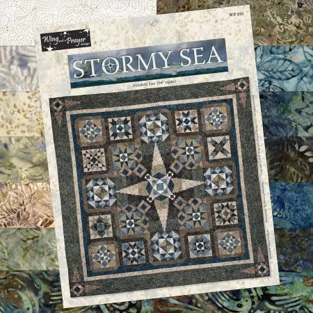 Stormy Seas Block of the Month Quilt Programby Wing & A Prayer shows a blue, tan, brown, green and cream quilt designed by Wing & A Prayer with fabrics by Timeless Treasures in a very modern design.